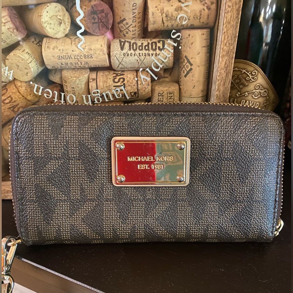 Michael Kors - Dark brown leather wallet w/gold hardware, w/leather wrist strap.